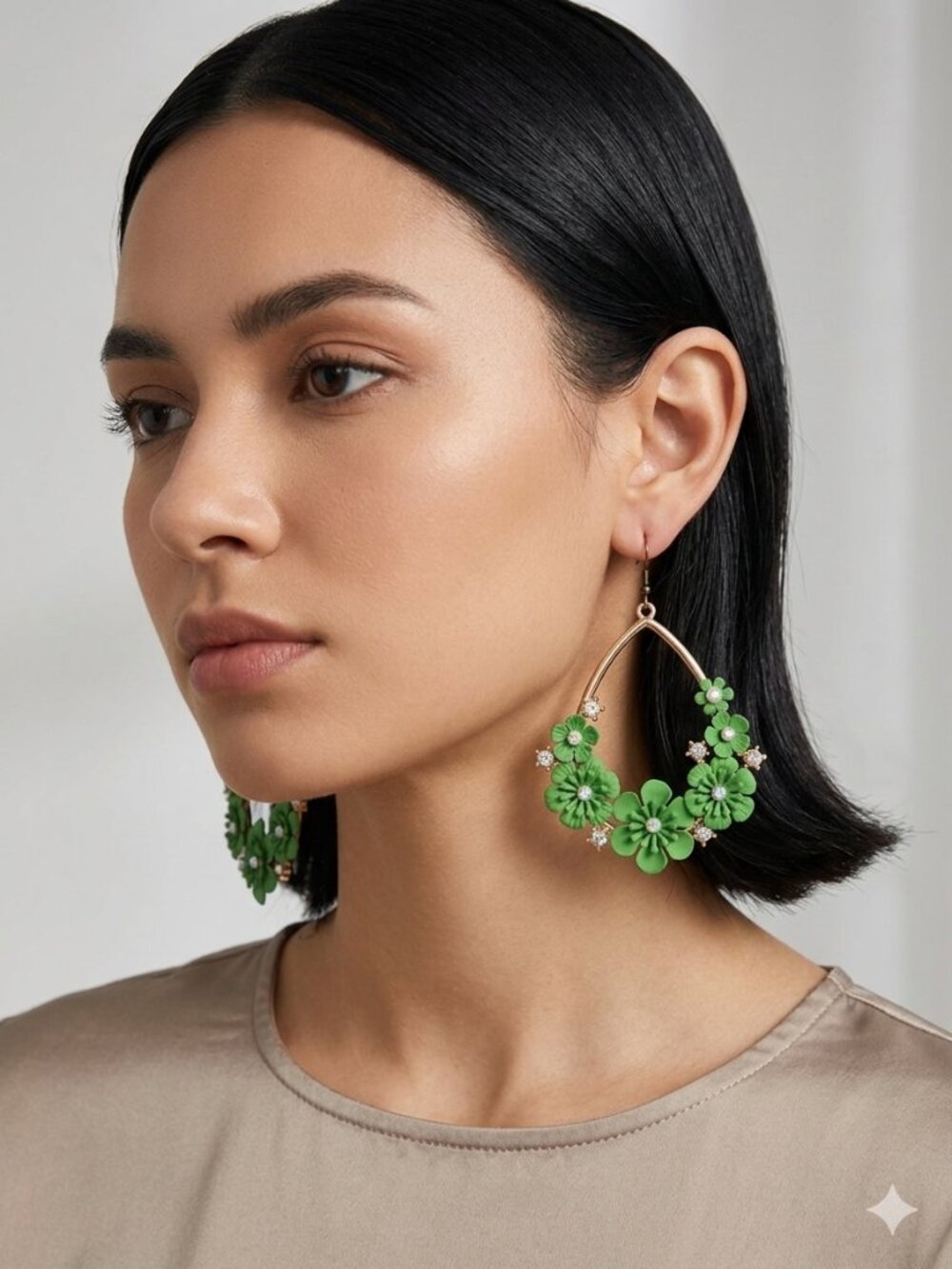 Striking statement earrings in the shape of large teardrops, featuring dimension